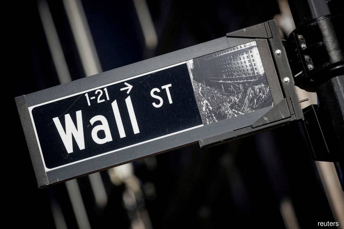 Wall Street closes higher as worries ease around Fed, Russian default